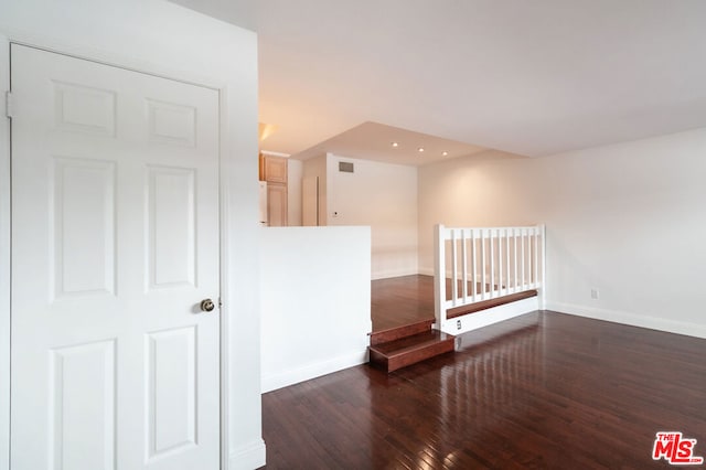 interior space with dark hardwood / wood-style floors