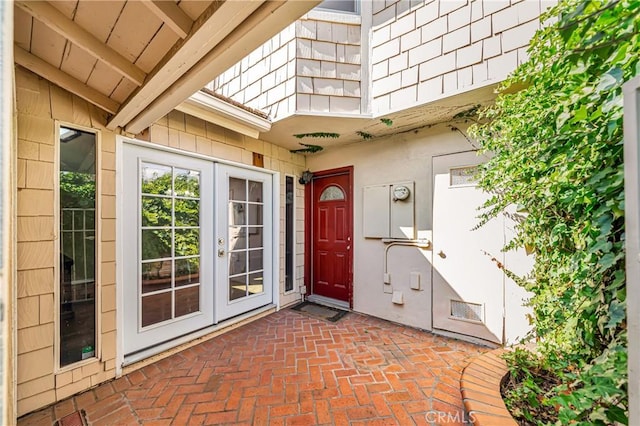 entrance to property featuring a patio and french doors