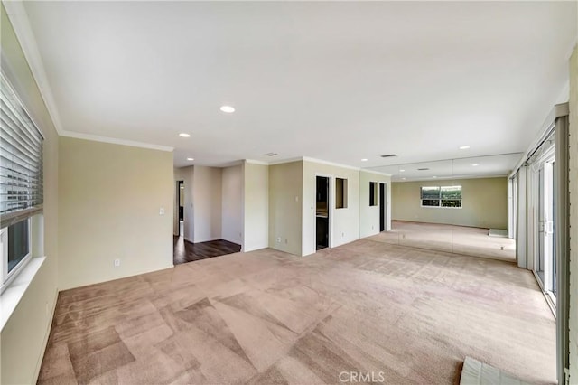 carpeted spare room with ornamental molding