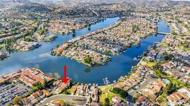 birds eye view of property featuring a water view