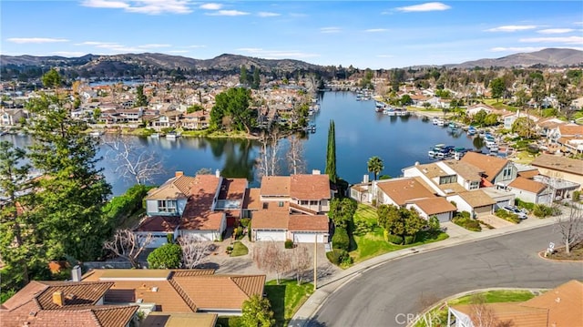 drone / aerial view with a water and mountain view