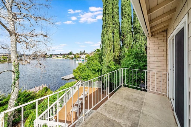 balcony featuring a water view