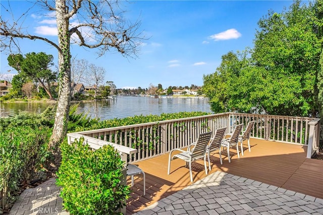 wooden deck featuring a water view