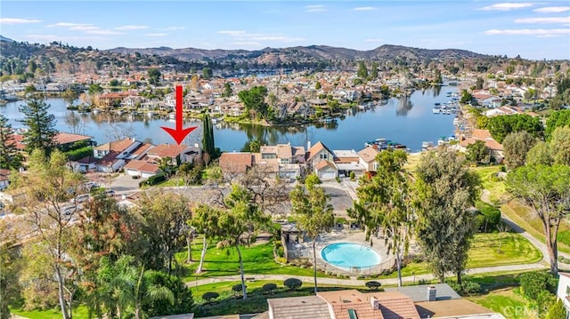 birds eye view of property featuring a water and mountain view