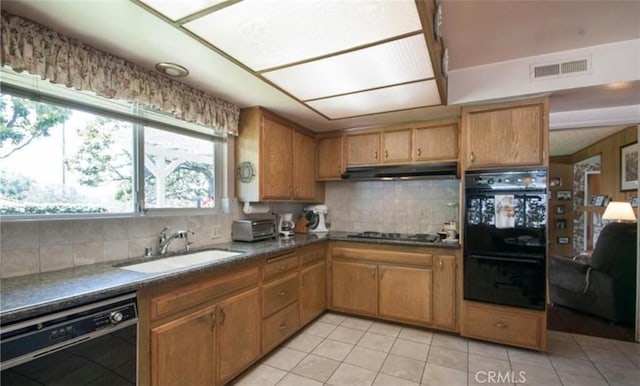 kitchen with sink, backsplash, black appliances, and light tile patterned flooring