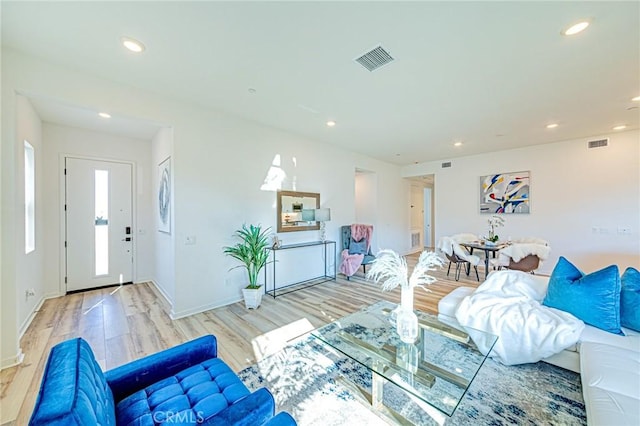 living room with light hardwood / wood-style flooring