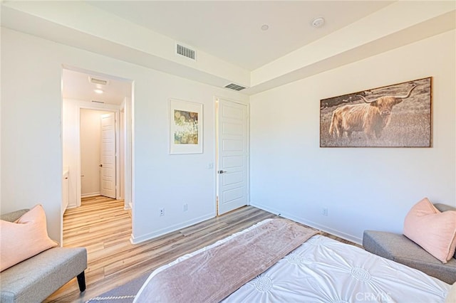 bedroom with hardwood / wood-style floors