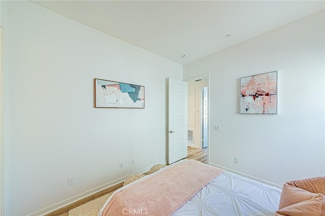 bedroom featuring light wood-type flooring