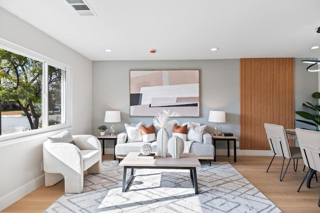 living room with light hardwood / wood-style floors