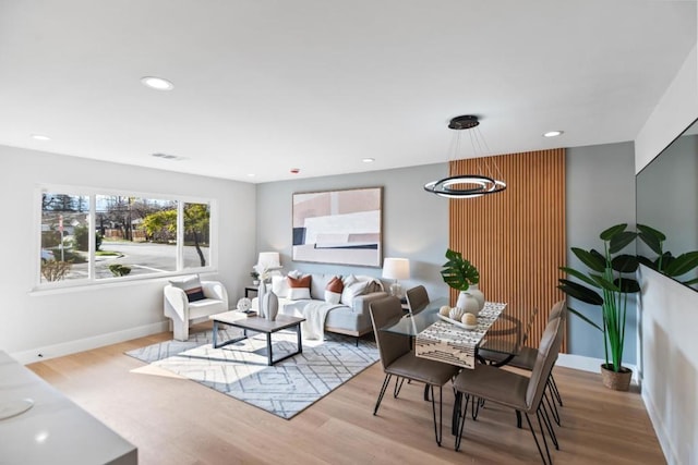 living room with light hardwood / wood-style flooring