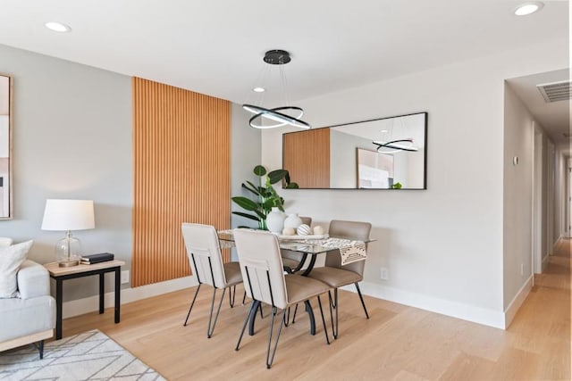 dining space featuring light hardwood / wood-style floors