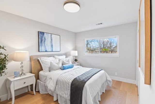 bedroom with light hardwood / wood-style floors