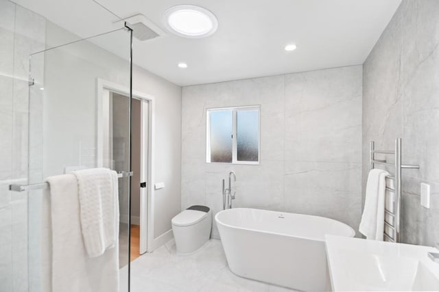 bathroom featuring shower with separate bathtub, tile walls, and toilet