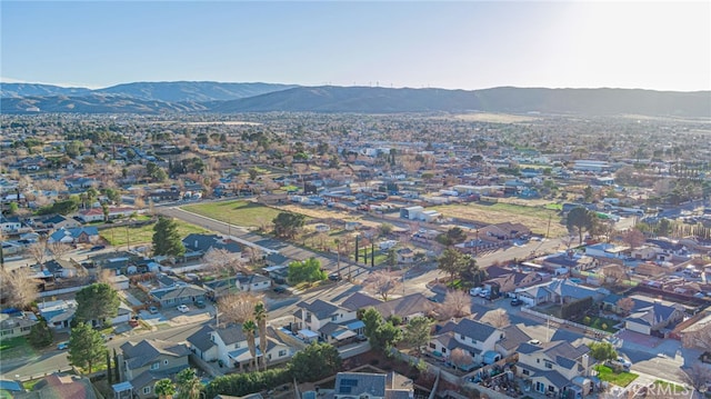 drone / aerial view featuring a residential view and a mountain view