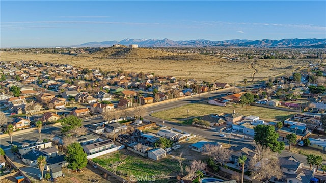 birds eye view of property with a residential view and a mountain view