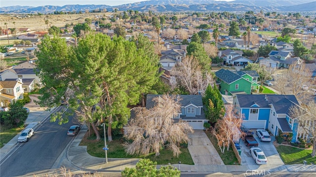 drone / aerial view featuring a residential view and a mountain view