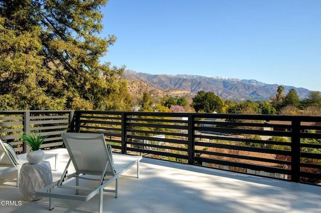 balcony featuring a mountain view