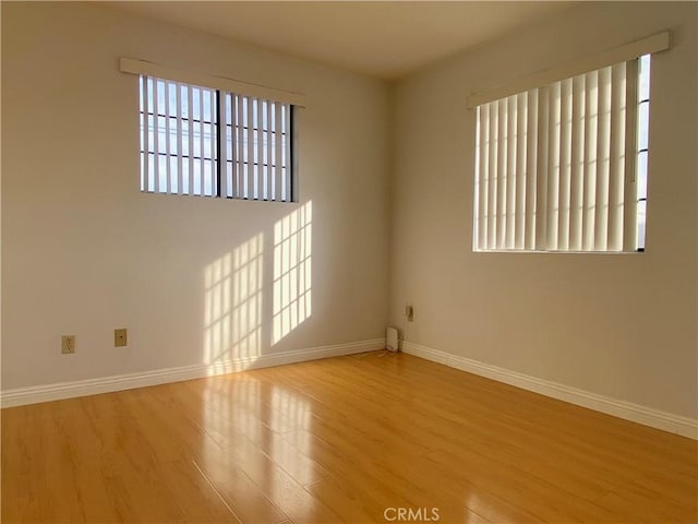 unfurnished room featuring light hardwood / wood-style flooring