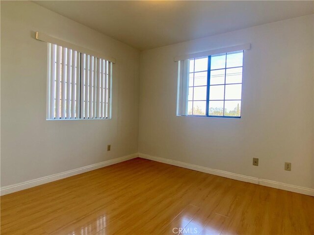 empty room with light wood-type flooring