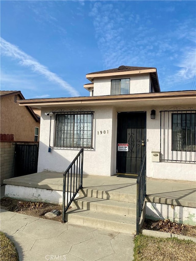 view of front of home featuring stucco siding