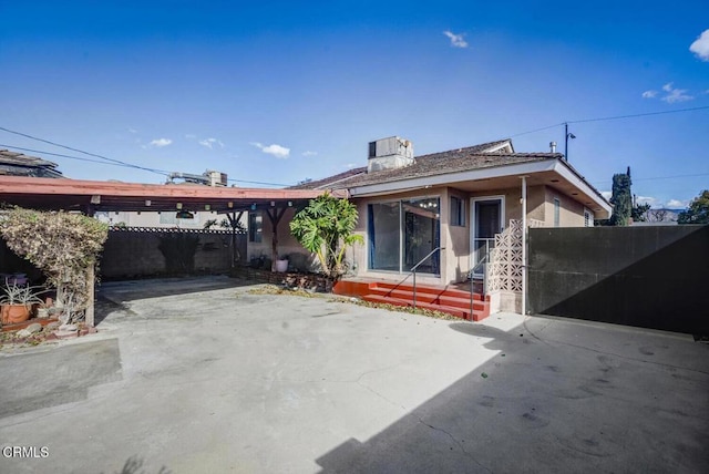 rear view of house featuring a patio area