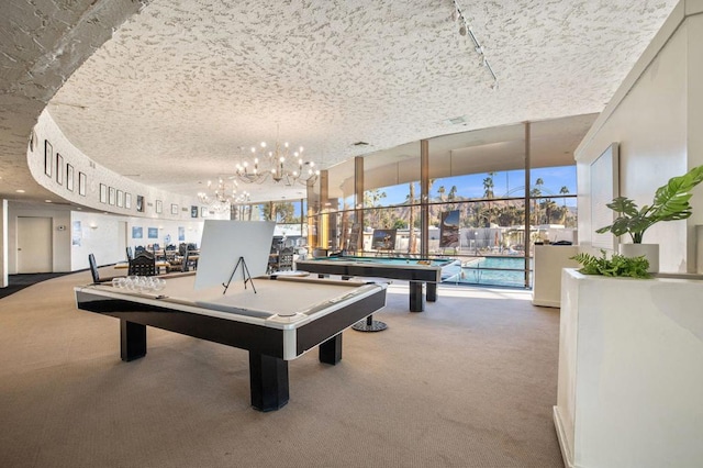 rec room featuring pool table, a textured ceiling, and carpet flooring