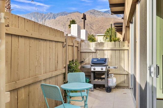 view of patio / terrace with a mountain view