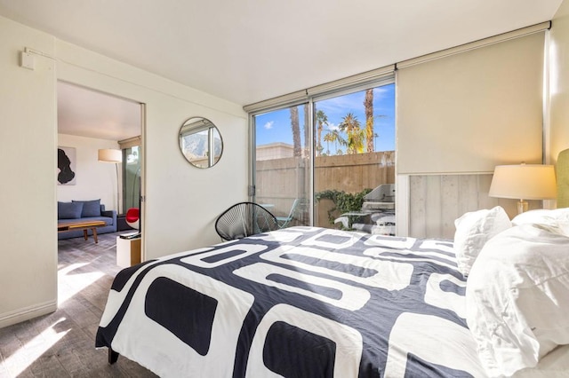 bedroom featuring floor to ceiling windows