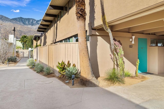 view of property exterior featuring a mountain view