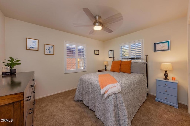 bedroom with light carpet and ceiling fan