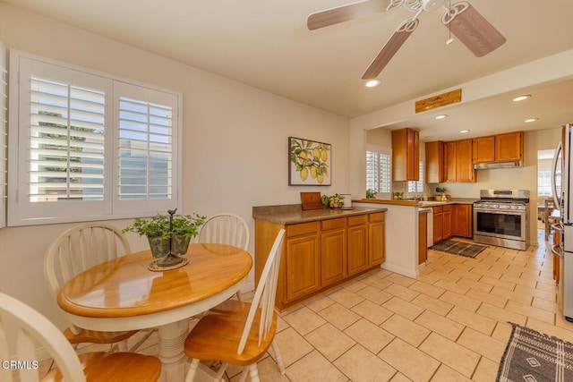 kitchen featuring ceiling fan, a healthy amount of sunlight, and appliances with stainless steel finishes