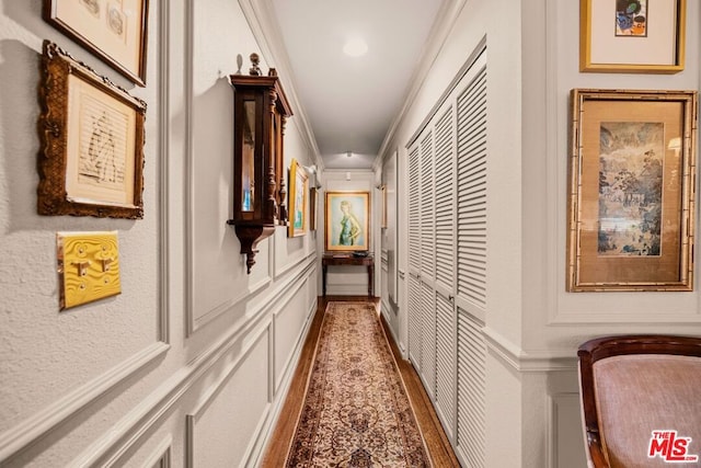 hall featuring ornamental molding