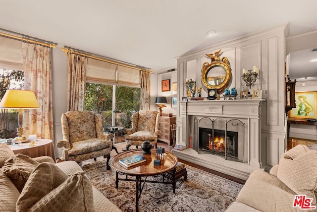 living room with hardwood / wood-style flooring and a fireplace