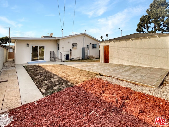 back of property with a patio area