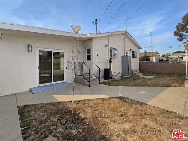 back of property featuring a patio