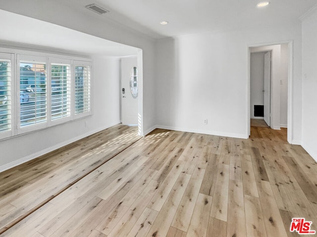 spare room featuring light hardwood / wood-style flooring