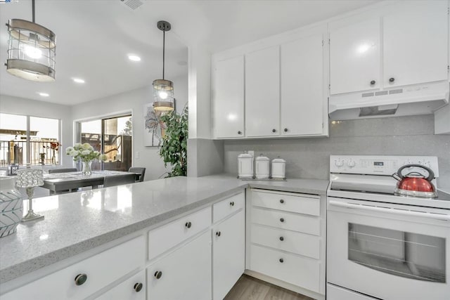 kitchen with white electric range, decorative light fixtures, tasteful backsplash, white cabinetry, and light stone counters