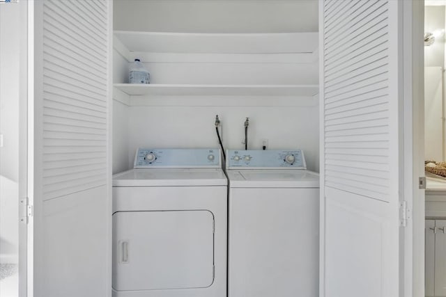 laundry area with washing machine and clothes dryer