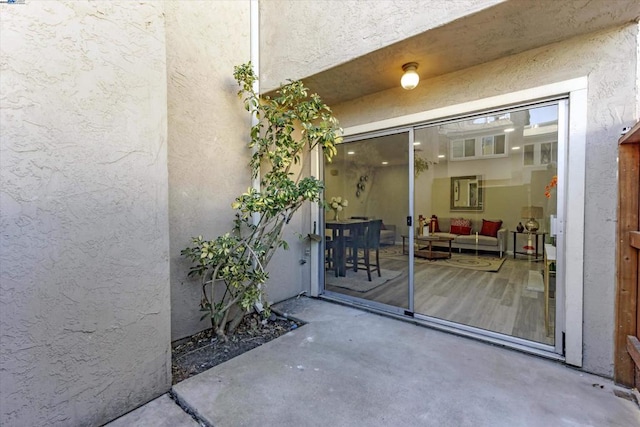 doorway to property with a patio area