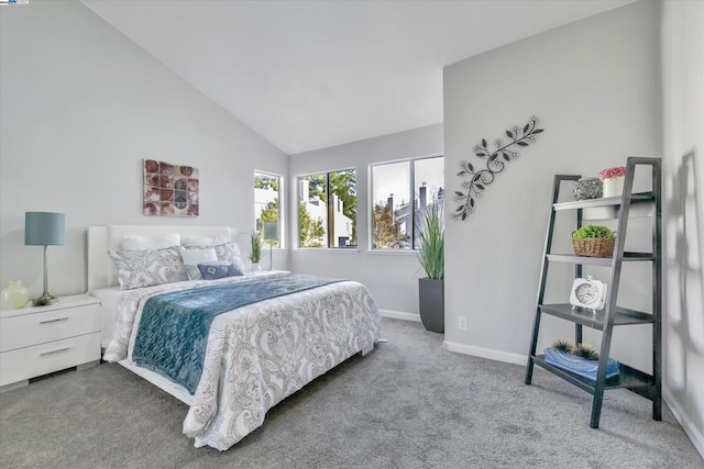 bedroom featuring lofted ceiling and carpet flooring