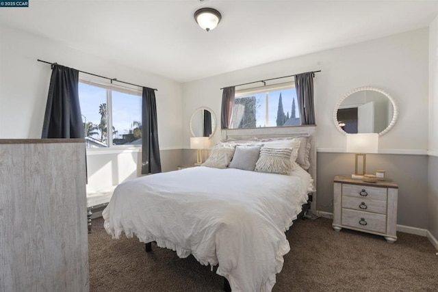 bedroom with dark colored carpet