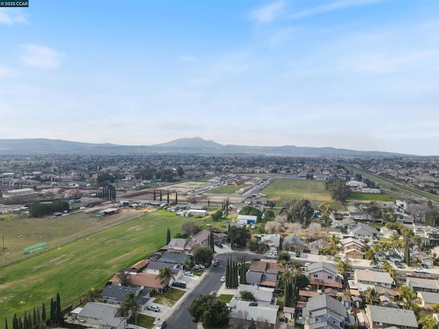 birds eye view of property with a mountain view