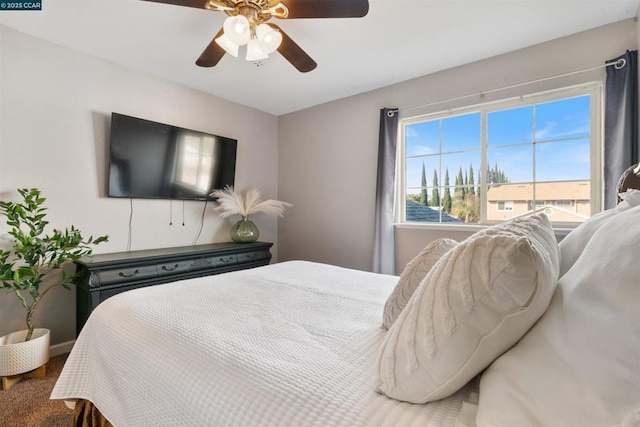 bedroom with ceiling fan and carpet