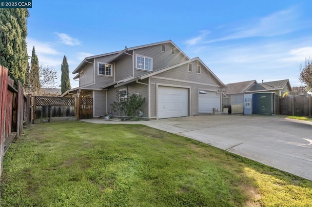 view of front of property featuring a garage and a front lawn