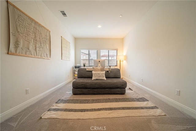 living area featuring carpet floors