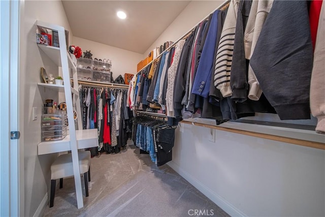 spacious closet with carpet flooring