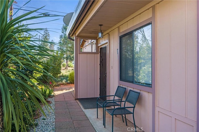 view of exterior entry featuring a patio area