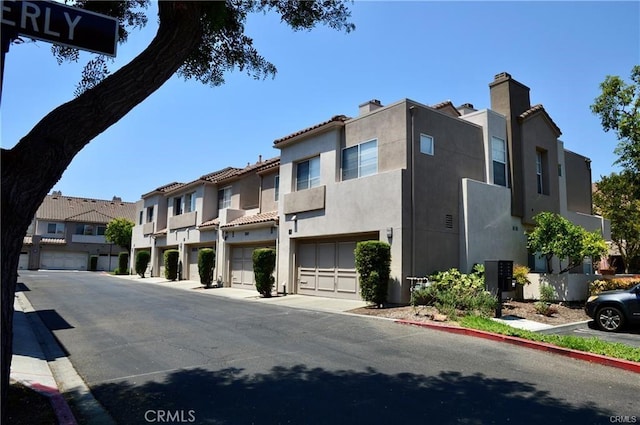 view of road with curbs, sidewalks, and a residential view