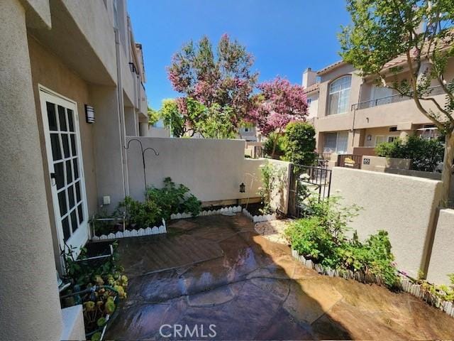 view of patio featuring fence