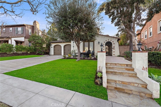 mediterranean / spanish house with a front yard